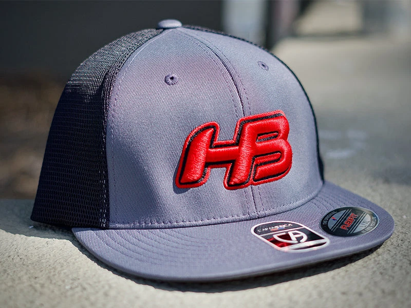 Headbanger Sports I8501 Cap America Flexfit Performance Trucker Mesh Back Hat: Graphite / Red 1 Headbanger Sports I8501 Cap America Flexfit Performance Trucker Mesh Back Hat: Graphite / Red