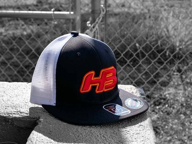 Headbanger Sports I8501 Cap America Flexfit Performance Trucker Mesh Back Hat: Black / White / Sunset 2 Headbanger Sports I8501 Cap America Flexfit Performance Trucker Mesh Back Hat: Black / White / Sunset - Image 2